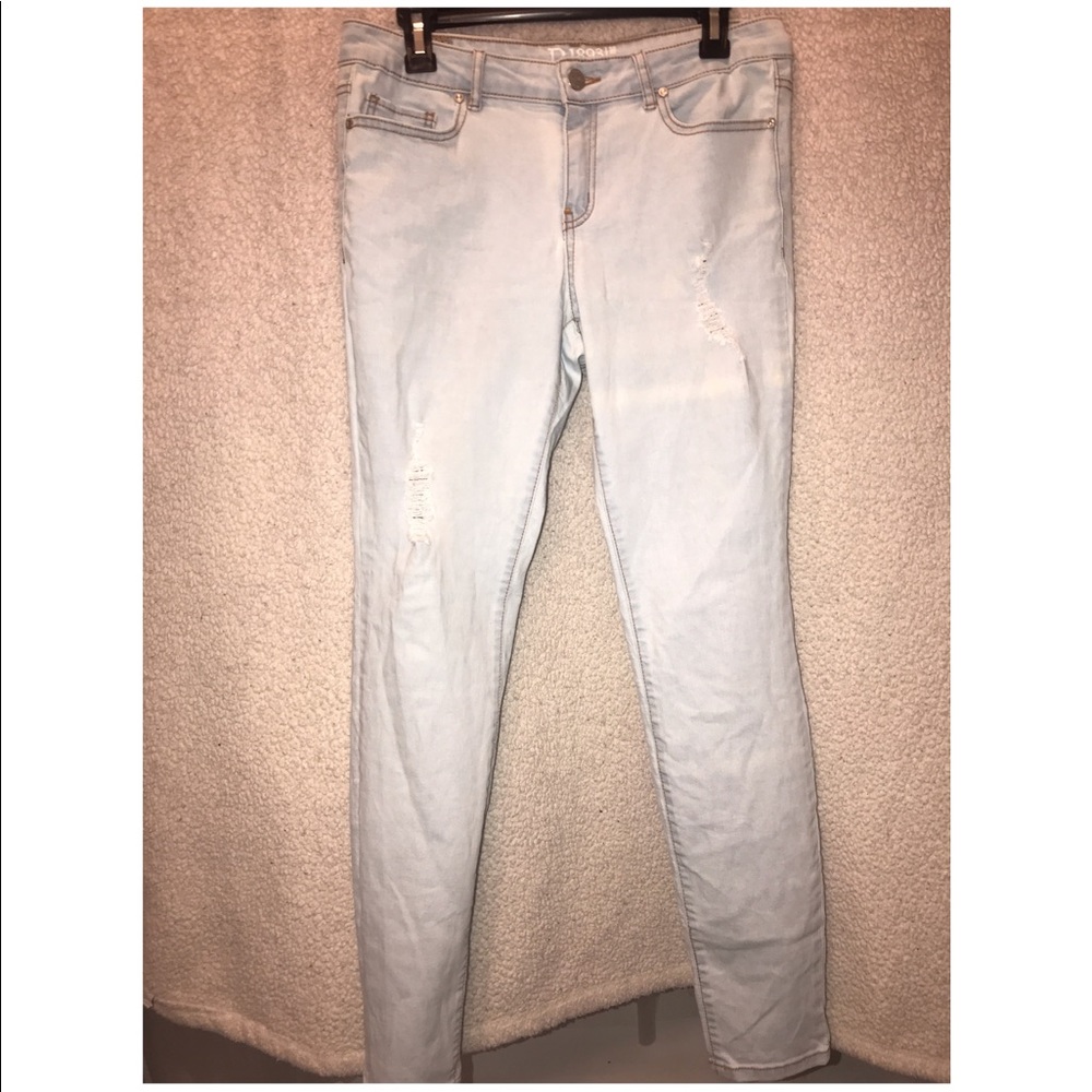 Light was bleached/white jeans with small tears
